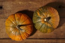 Pumpkins on wooden surface — Stock Photo