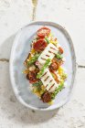 Couscous salad with antipasti and haloumi — Stock Photo