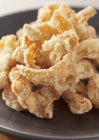 Closeup view of chicken deep-fried strips in batter — Stock Photo
