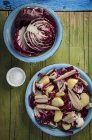 Radicchio and potato salads with mackerel — Stock Photo