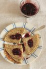 Pancakes with red berry jam — Stock Photo