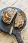 Bread on wooden board — Stock Photo