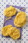 Homemade tagliatelle pasta nests — Stock Photo