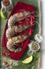 Raw prawns with spices and herbs — Stock Photo