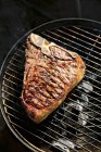 T-bone steak on barbecue — Stock Photo