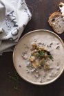 Mushroom soup with fresh thyme — Stock Photo