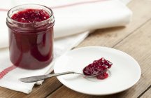 Red berry jam in jar — Stock Photo