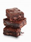 Stack of chocolate brownies with berries — Stock Photo