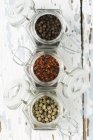 Top view of various spices in opened storage jars — Stock Photo