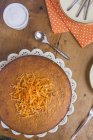 Carrot cake on set table — Stock Photo