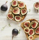 Toast with figs on wooden surface — Stock Photo