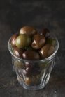 Glass of black and green olives — Stock Photo