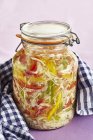 Pickled pusztakraut in jar over towel — Stock Photo