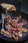 Fried bacon in pan — Stock Photo