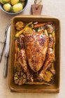 Roasted whole chicken with garlic — Stock Photo