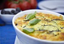 Moussaka with basil in dish — Stock Photo