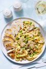 Tagliatelle pasta with chicken — Stock Photo