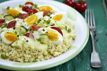 Couscous with egg and vegetables sauce serving — Stock Photo