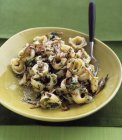 Tortellini pasta with mushrooms — Stock Photo