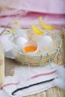 Fresh eggs with feathers — Stock Photo