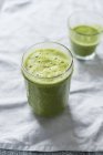 Green smoothie in glasses — Stock Photo
