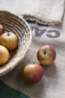 Apples and jute sack — Stock Photo