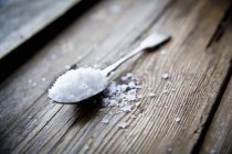 Sea salt on spoon — Stock Photo