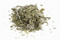 Dried sage leaves on a white surface — Stock Photo