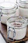 Glass jars with Vanilla pudding — Stock Photo