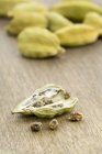 Cardamom seeds on board — Stock Photo