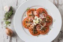 Tomato salad with anchovies — Stock Photo