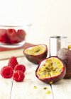 Ingredients for passion fruit and raspberry martinis — Stock Photo