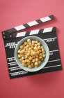 Popcorn in green bowl — Stock Photo