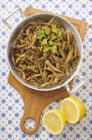 Fried anchovies in pan — Stock Photo