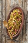 Closeup view of Tabbouleh with figs and nuts on oval plate — Stock Photo