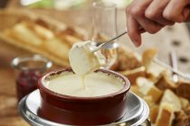 Cheese fondue and bread — Stock Photo