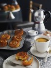 Closeup view of Kouign Amann yeast dough pastries with coffee — Stock Photo