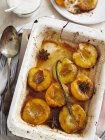 Closeup top view of oven baked nectarines with spices — Stock Photo