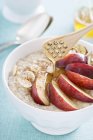 Porridge with peach and almonds — Stock Photo