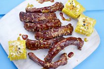 Pork ribs with corn cobs — Stock Photo