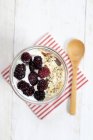 Oat muesli with blackberries and cream — Stock Photo