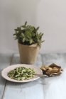 Fusili pasta with spinach and garlic — Stock Photo