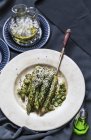 Asparagus with sesame on plate — Stock Photo