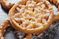 Closeup view of deep-fried Spanish Bunuelos with icing sugar — Stock Photo
