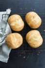 Bread rolls on rack — Stock Photo
