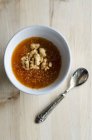 Persimmon soup with walnuts — Stock Photo