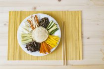 Gujeolpan - wraps with various fillings  on white plate over towel with chopsticks — Stock Photo