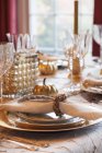 A festive table laid for Thanksgiving on table at room interior — Stock Photo