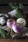 Turnips and fresh rosemary — Stock Photo
