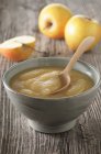 Closeup view of apple sauce with a spoon — Stock Photo
